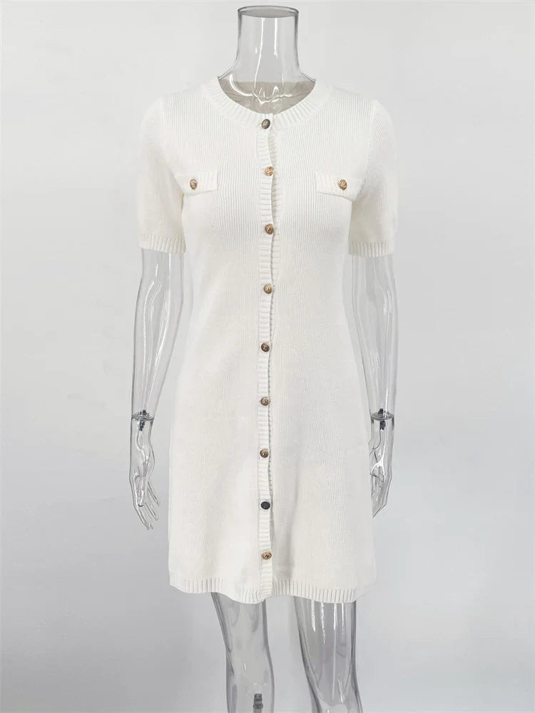 White cardigan with sheer sleeves on a mannequin against a white background