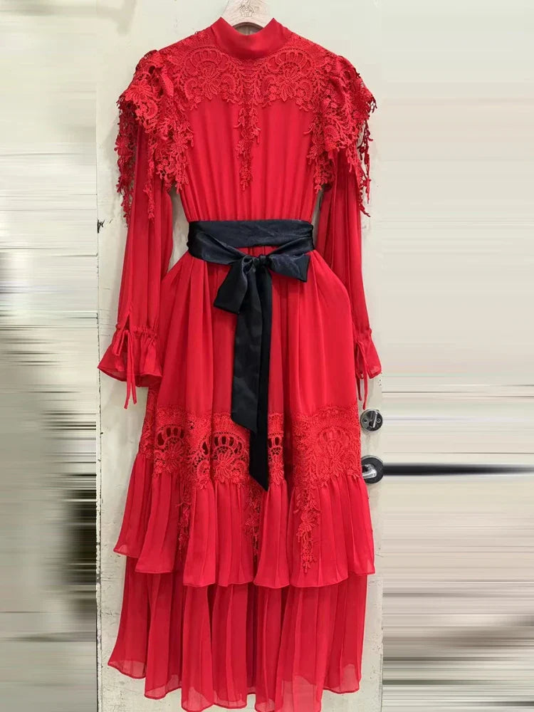 Red lace dress with a black belt on a white background