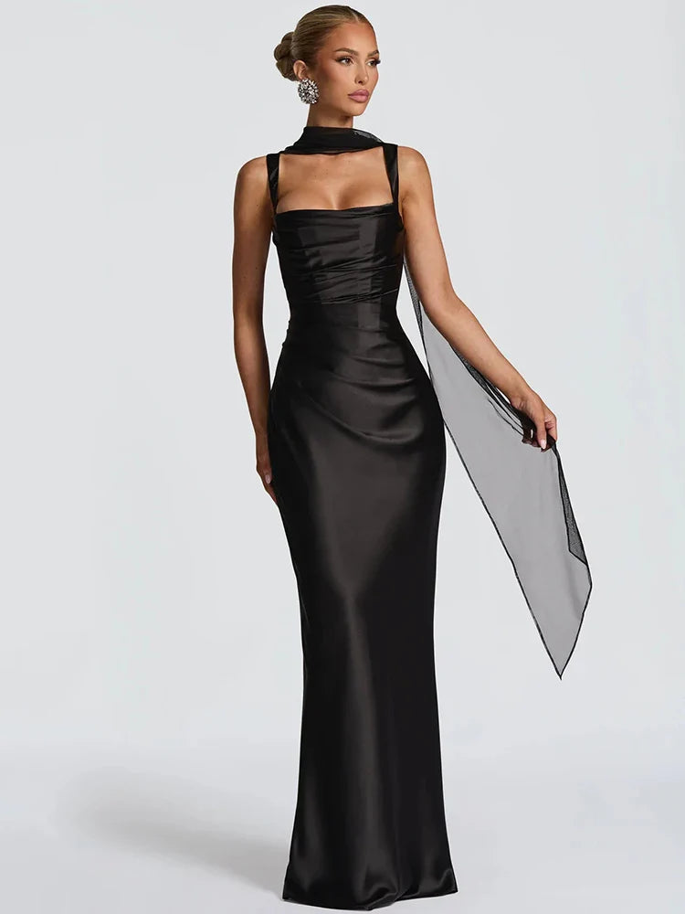 Woman wearing a black evening gown on a white background
