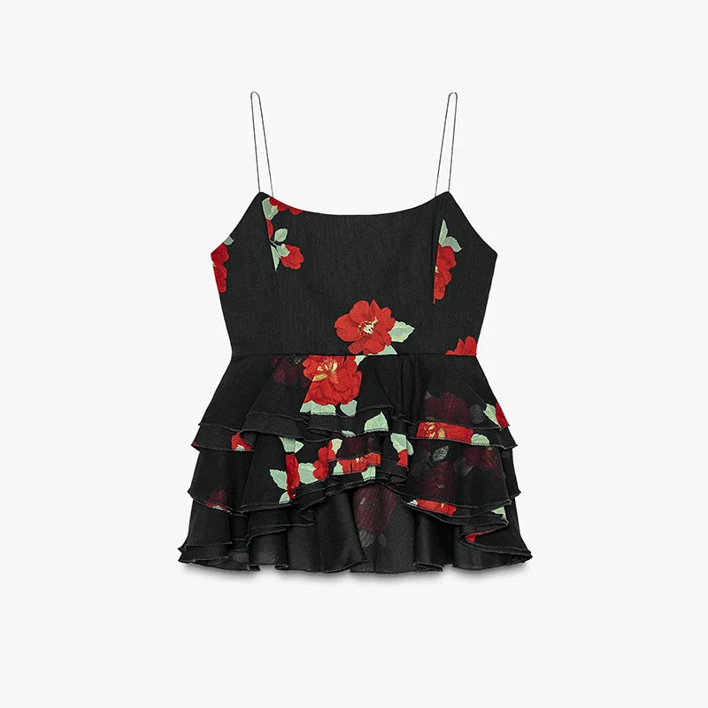 Black top with red floral patterns on a light gray background