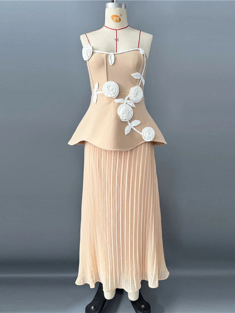 Beige dress with floral details on a mannequin against a gray background