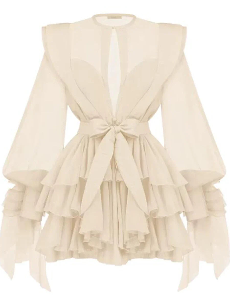 Beige ruffled dress with a tie detail on a white background