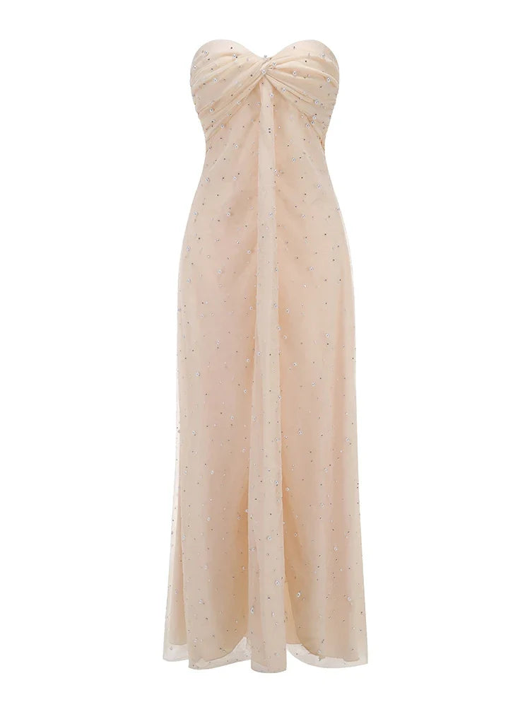 Beige strapless gown with a bow detail on a white background