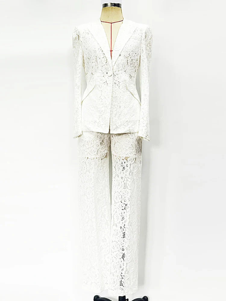 White lace suit on a mannequin against a white background