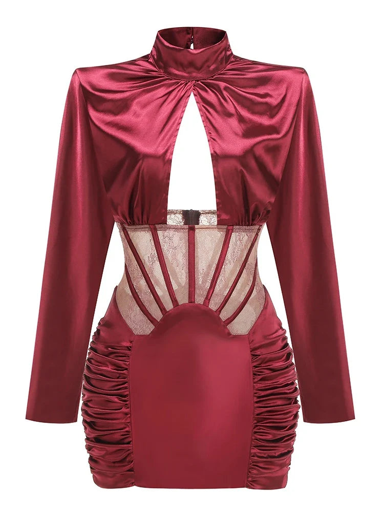 Red satin dress with long sleeves and sheer mesh panels on a white background