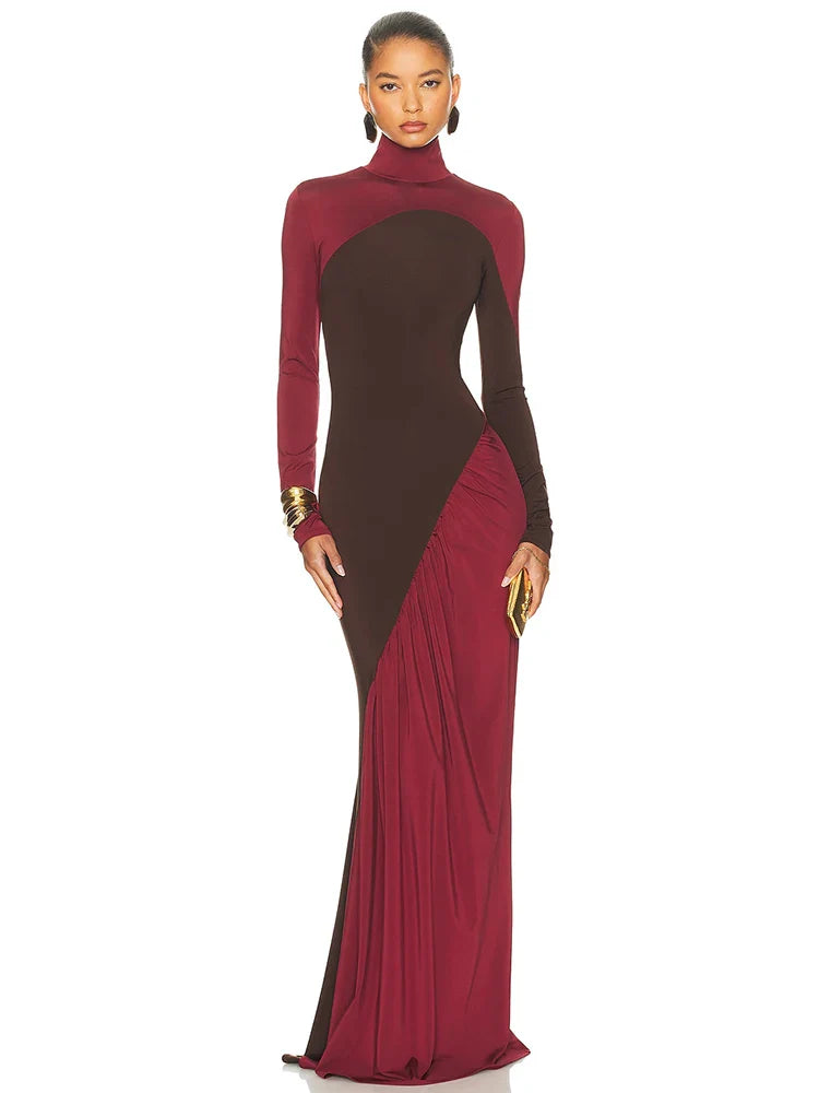 A woman wearing a two-tone dress with maroon and brown colours