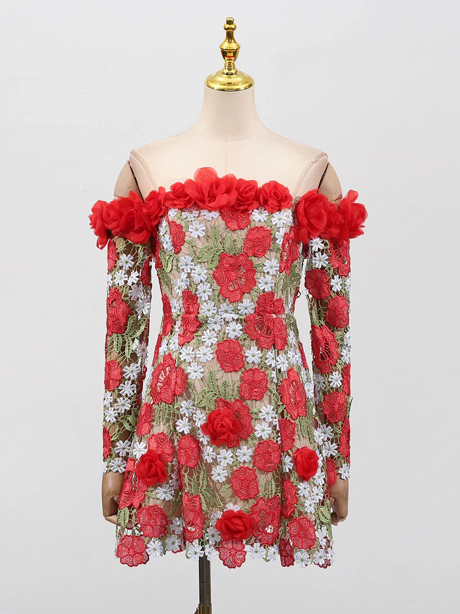 Dress with red floral patterns on a mannequin against a light gray background