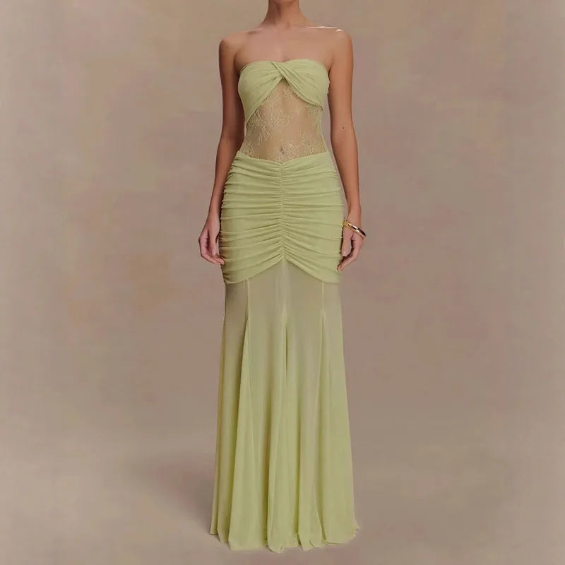 Light green strapless gown on a plain background