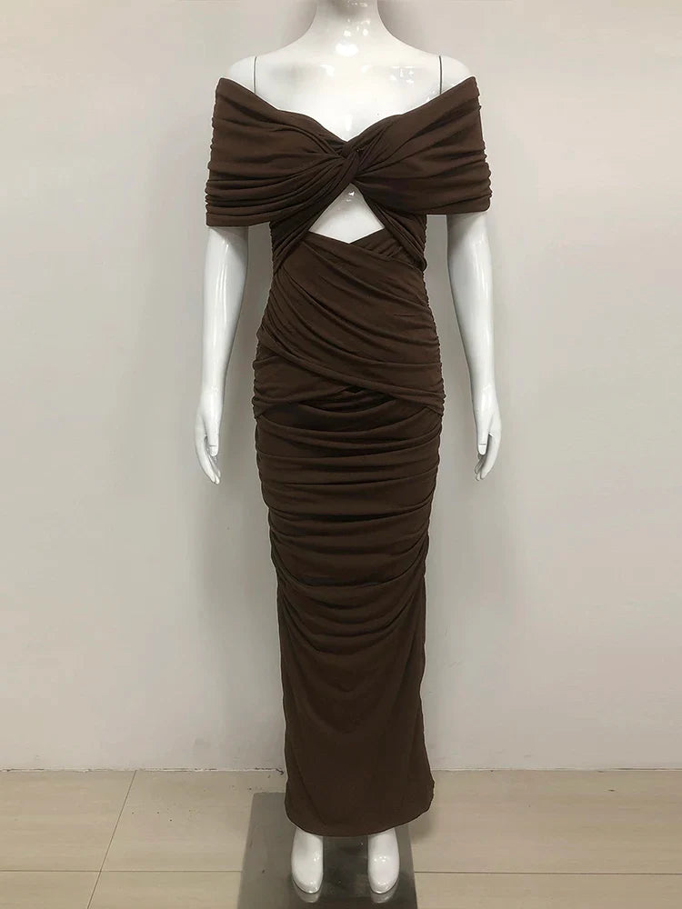 Brown evening gown on a mannequin against a white background
