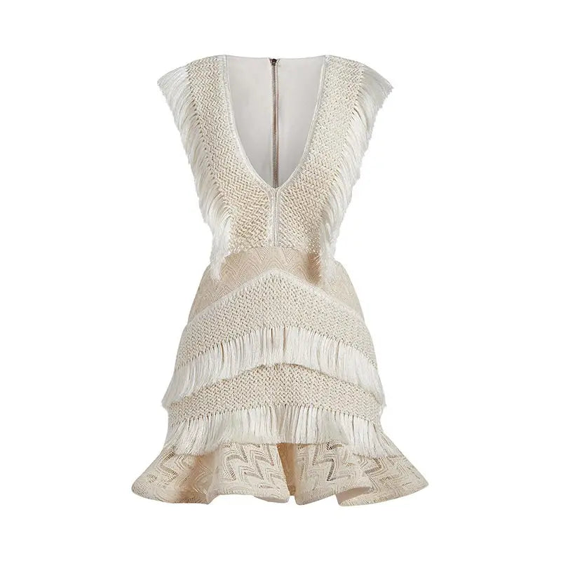 Beige sleeveless dress with intricate detailing on a white background