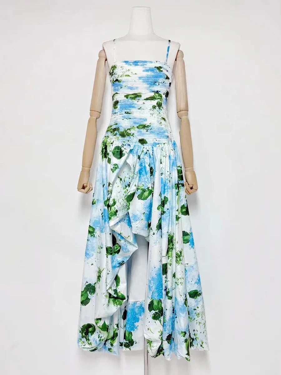 Mannequin wearing a floral dress with blue, green, and white pattern