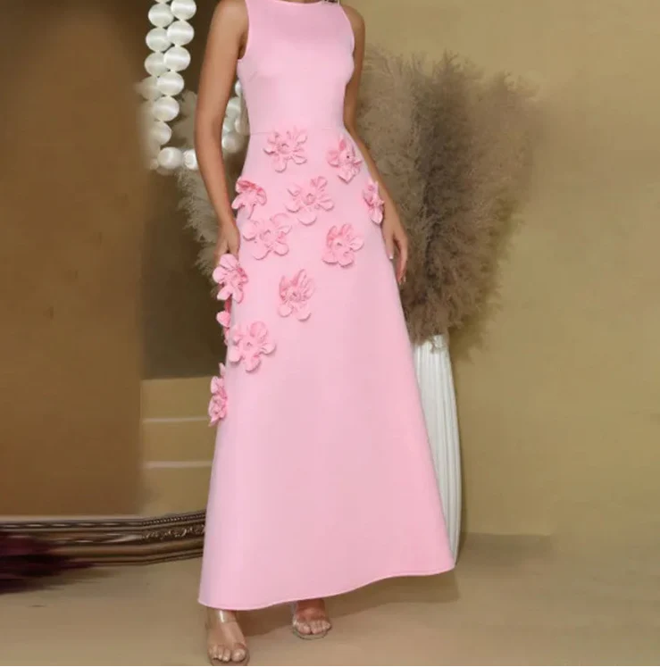 Pink dress with floral embellishments on a neutral background