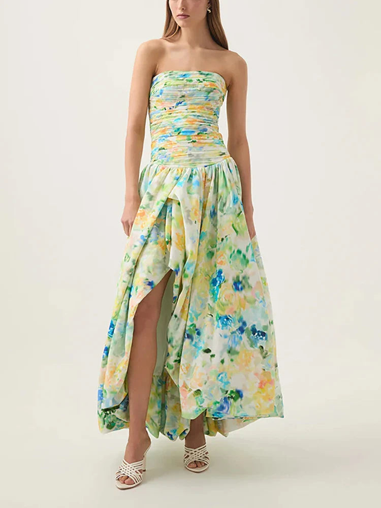 Woman wearing a strapless floral dress on a plain background