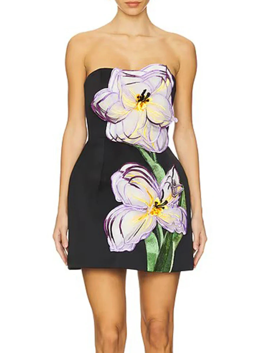 Woman wearing a strapless dress with floral design on a white background