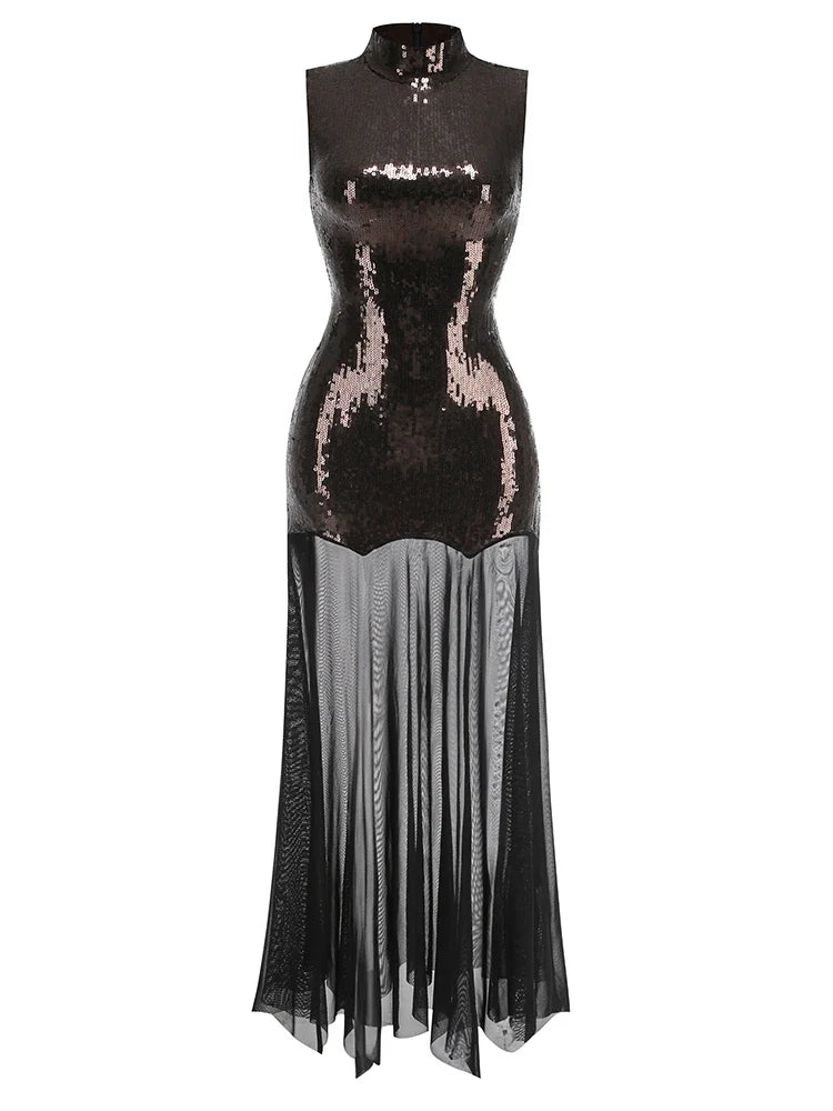 Black sequin dress with sheer overlay on a white background