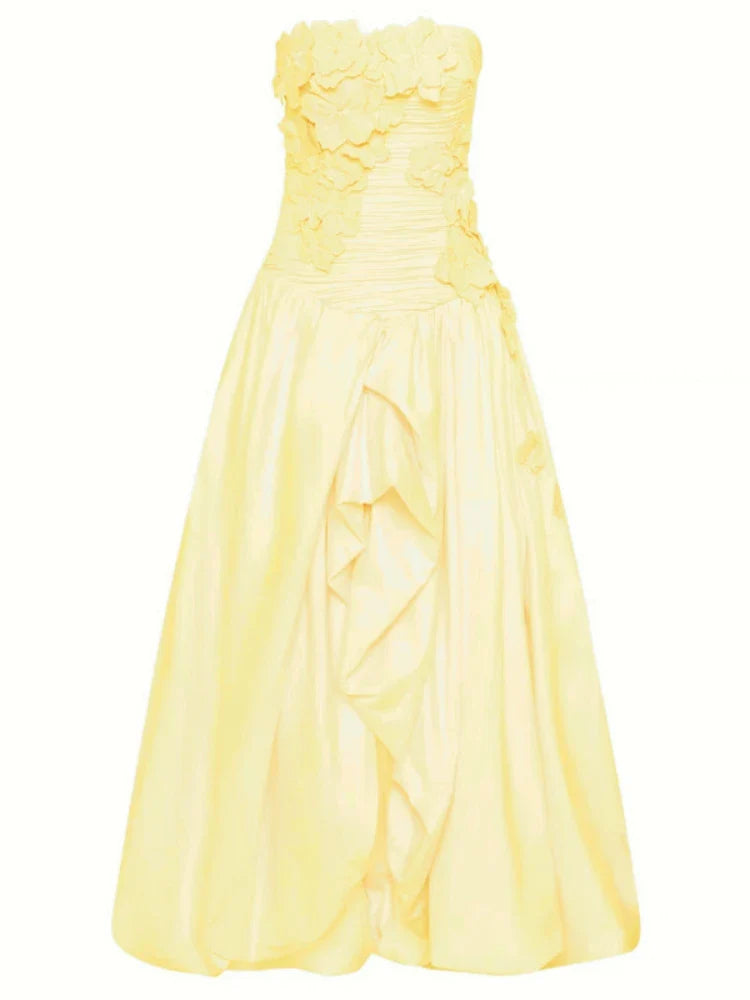 Yellow strapless dress on a white background