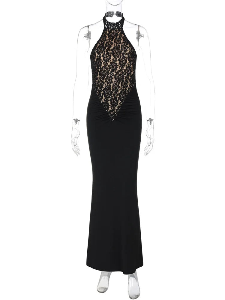Black evening gown with lace detailing on a mannequin against a white background