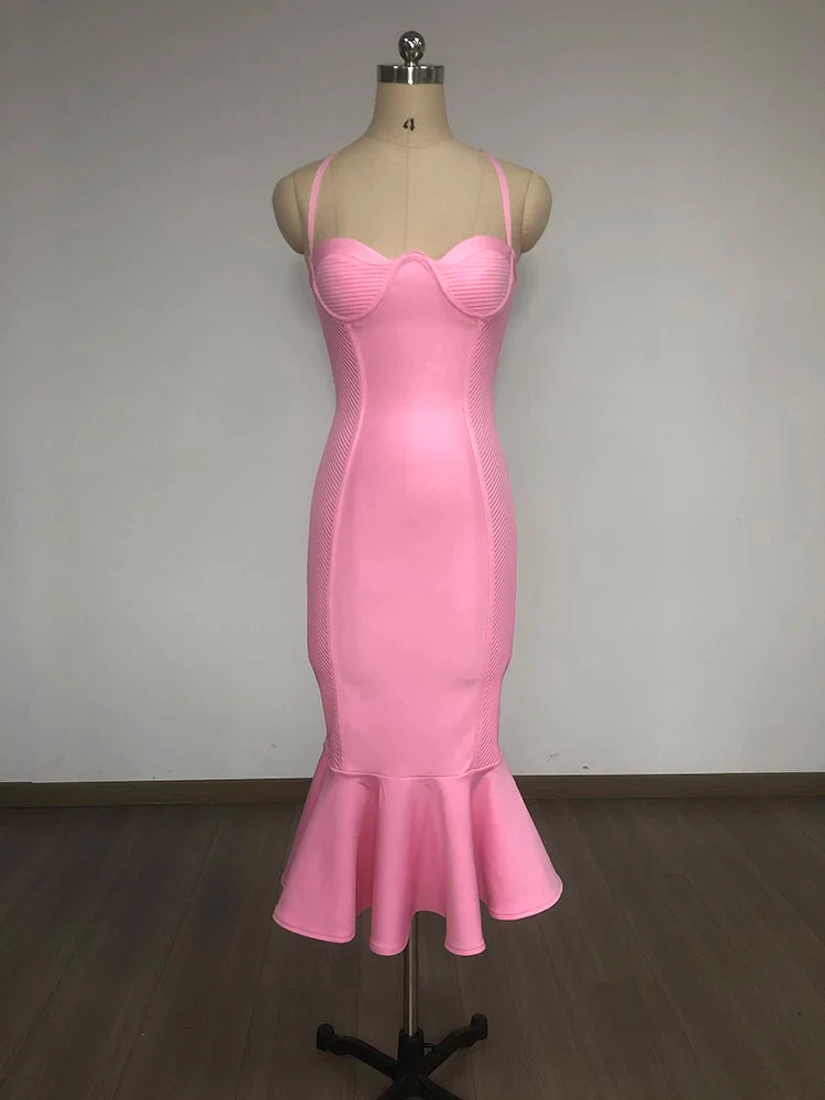 Pink dress on a mannequin against a plain background