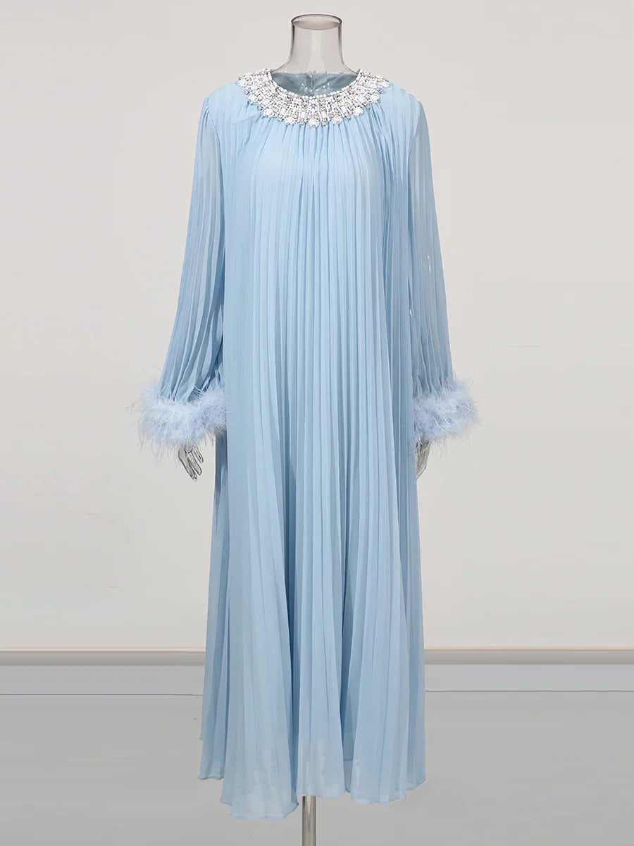 Light blue pleated dress with decorative collar on a mannequin against a white background