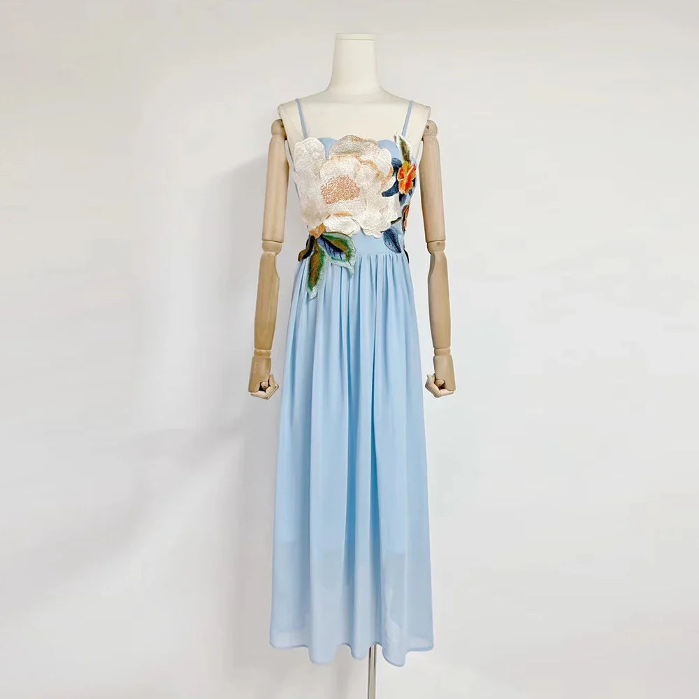 Mannequin wearing a floral top and light blue skirt on a white background