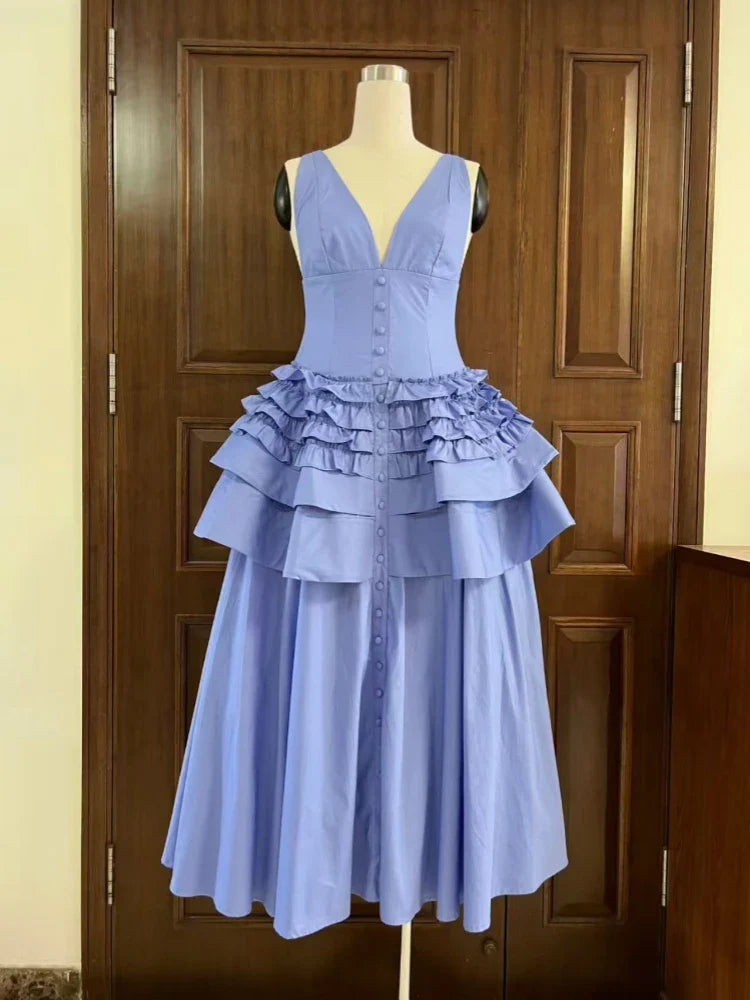 Light blue dress on a mannequin against a wooden door background