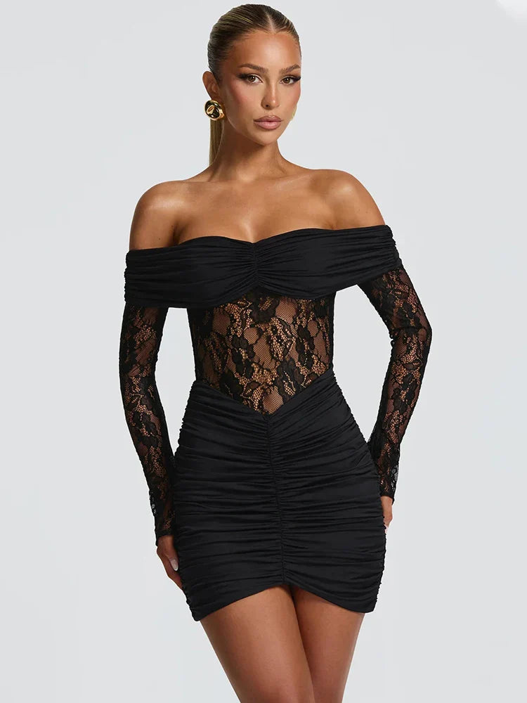 Black off-shoulder dress with lace detailing on a white background