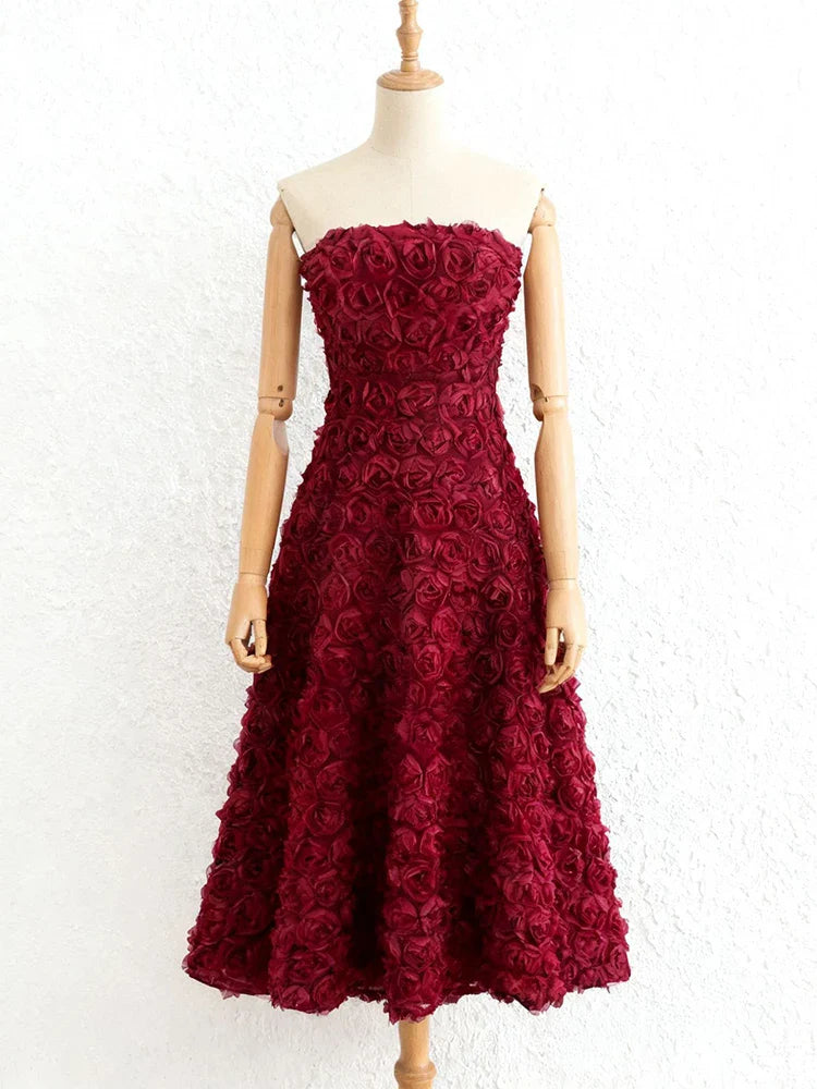 Elegant 3D floral burgundy gown styled for evening events