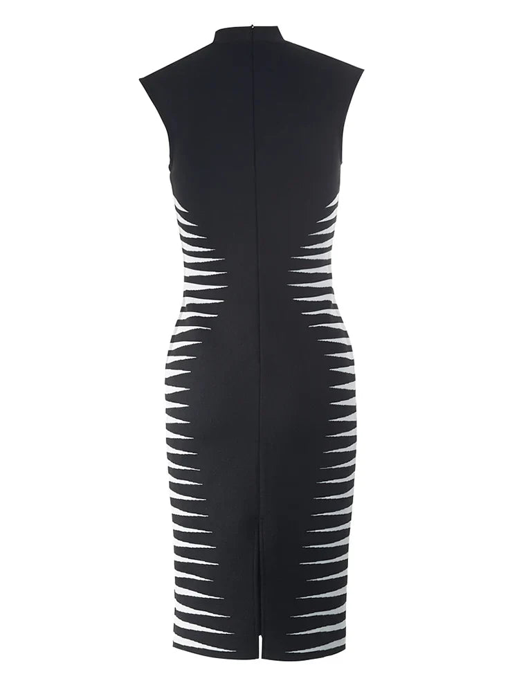 Black dress with cut-out design on a white background