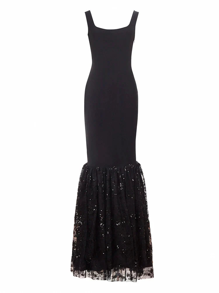 Black dress with a sequined skirt on a white background