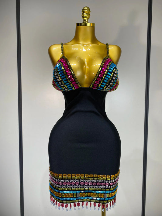 Black dress with colorful beaded top on a mannequin against a neutral background