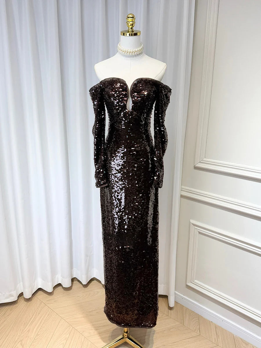 Brown shimmering evening dress shown with an elongated silhouette