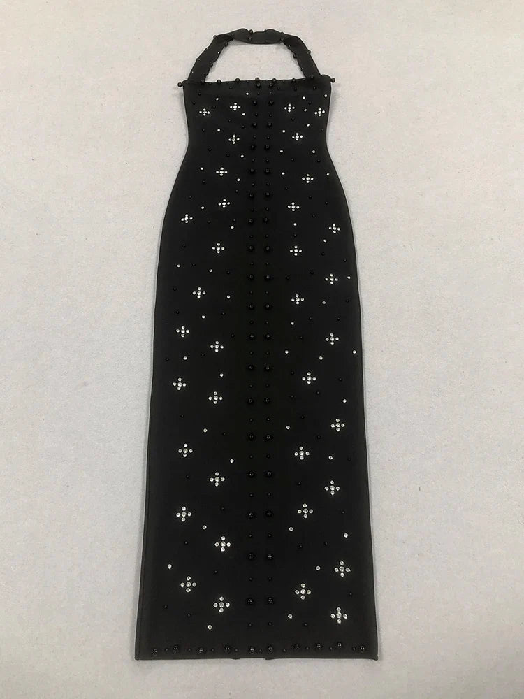 Black dress with white cross patterns on a white background