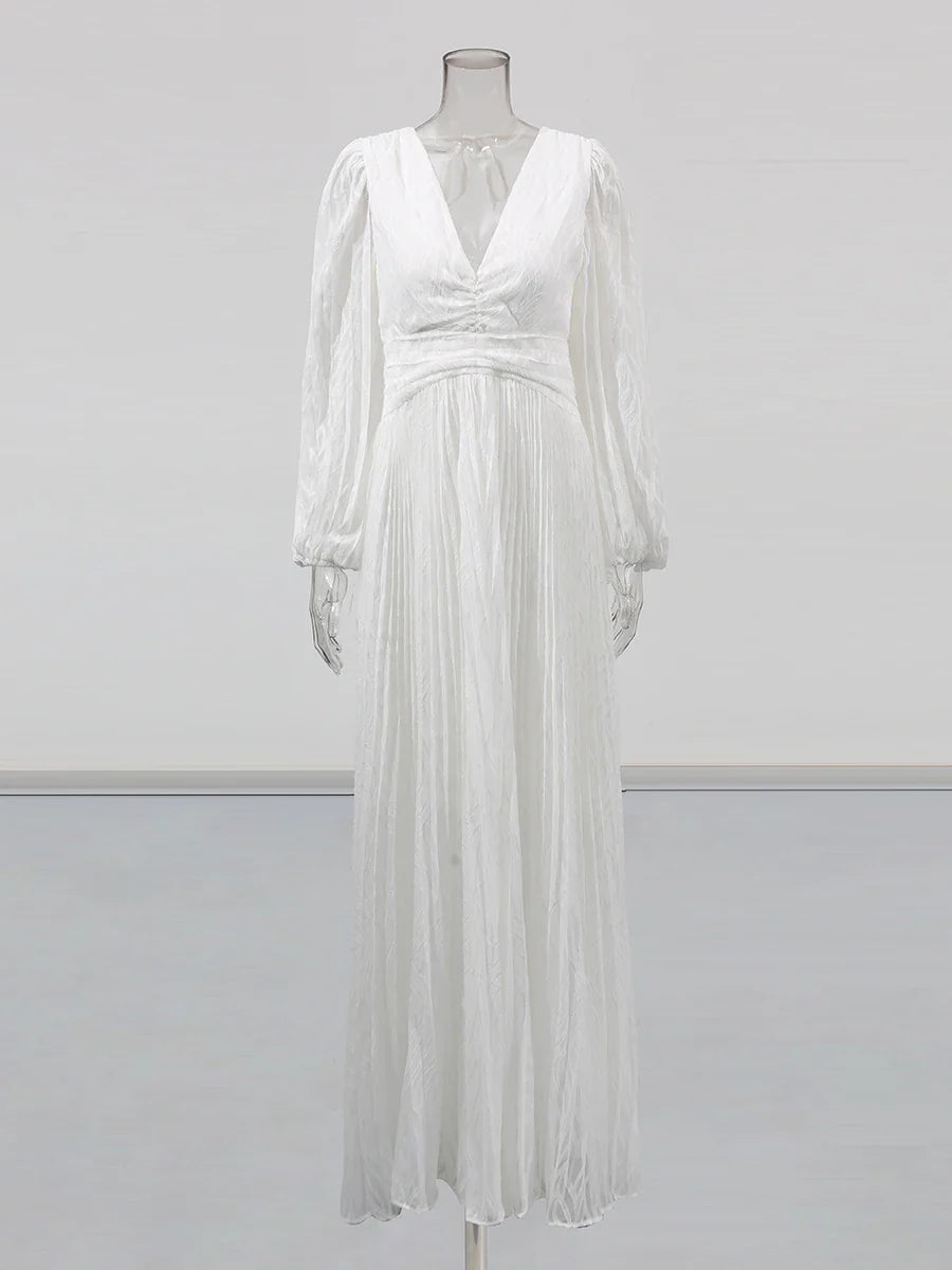 White dress on a mannequin against a light gray background