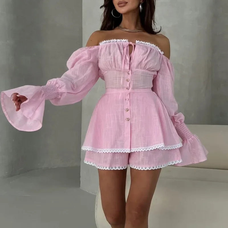 Pink off-shoulder dress with ruffled sleeves on a neutral background