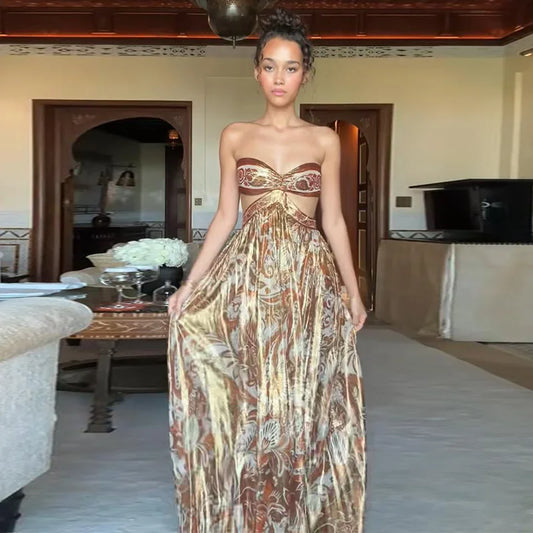 Woman in a patterned dress standing in an indoor setting