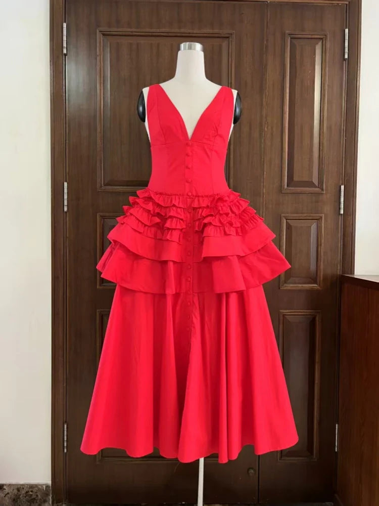 Red dress on a mannequin against a wooden door background