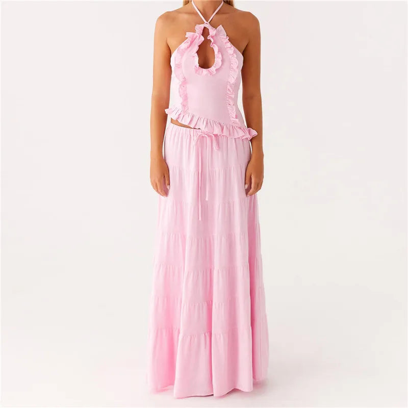 Pink halter top and long skirt set on a white background