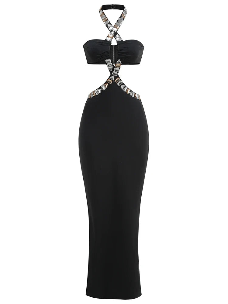 Black halter neck dress with silver embellishments on a white background