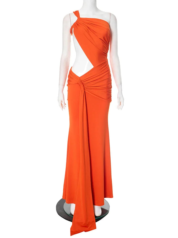 Orange evening gown on a mannequin against a white background