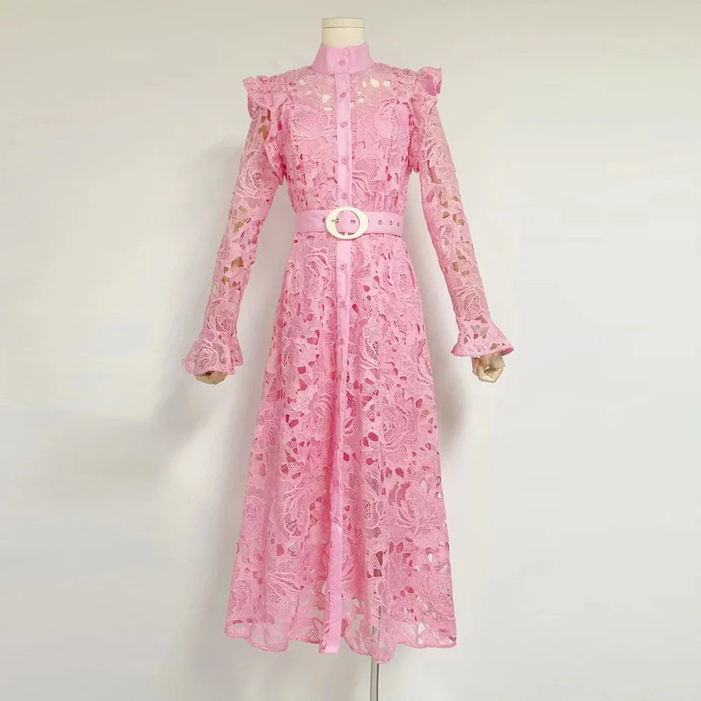 Pink lace dress on a mannequin against a white background