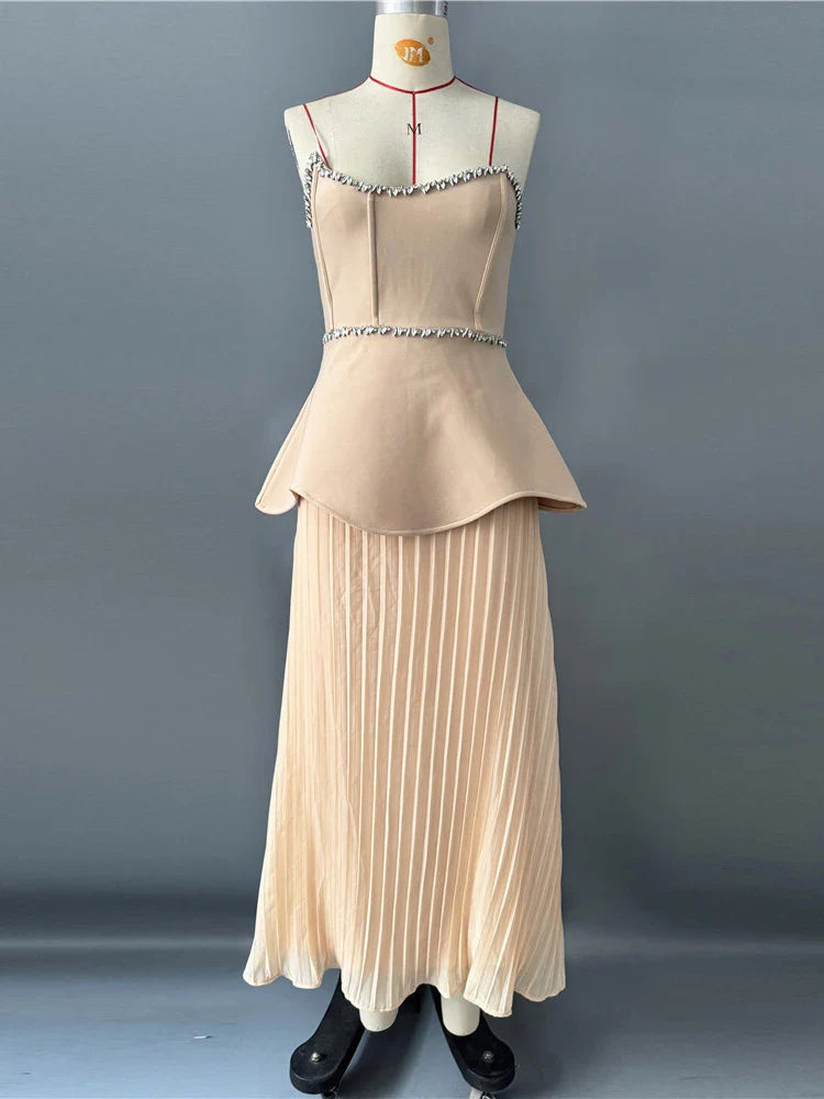 Beige dress on a mannequin against a gray background