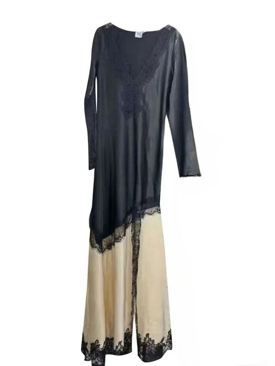 Long dress with black top and beige bottom on a white background