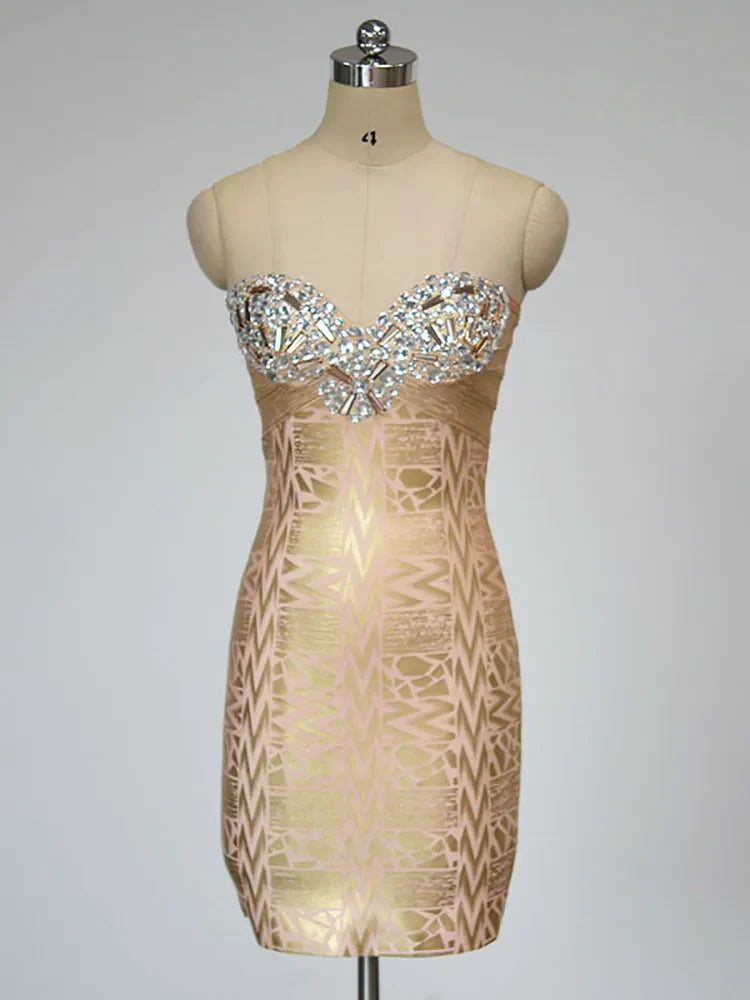 Beige strapless dress with intricate pattern on a mannequin against a gray background