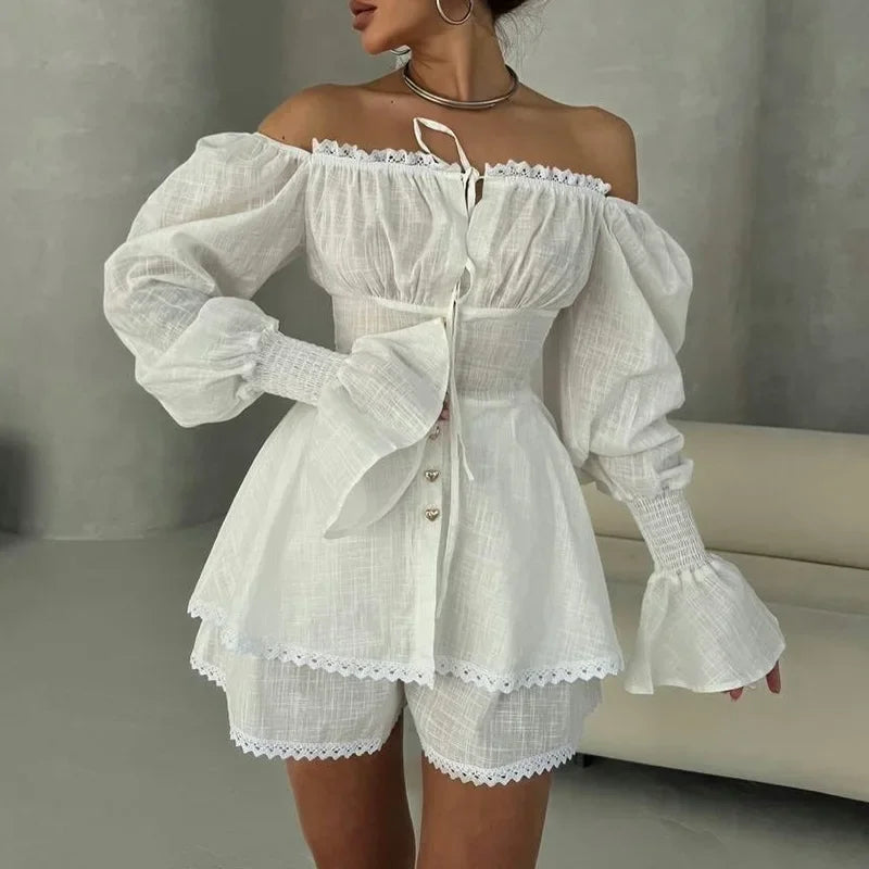 White off-shoulder top and shorts set with lace details on a neutral background