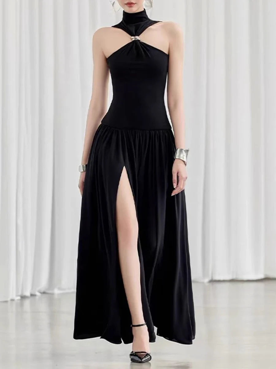 Black halter neck dress with a high slit 