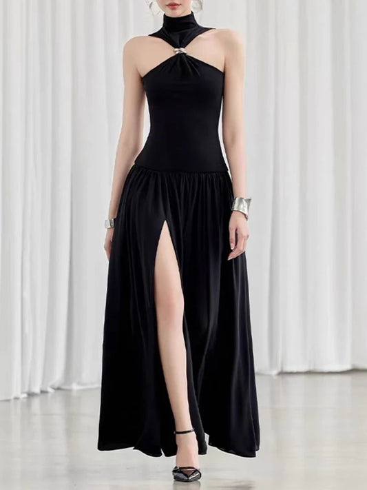 Black halter neck dress with a high slit 
