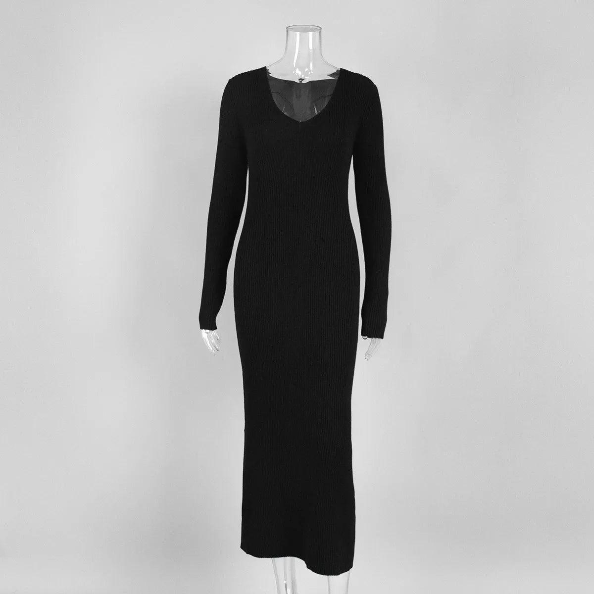 Black dress on a mannequin against a white background