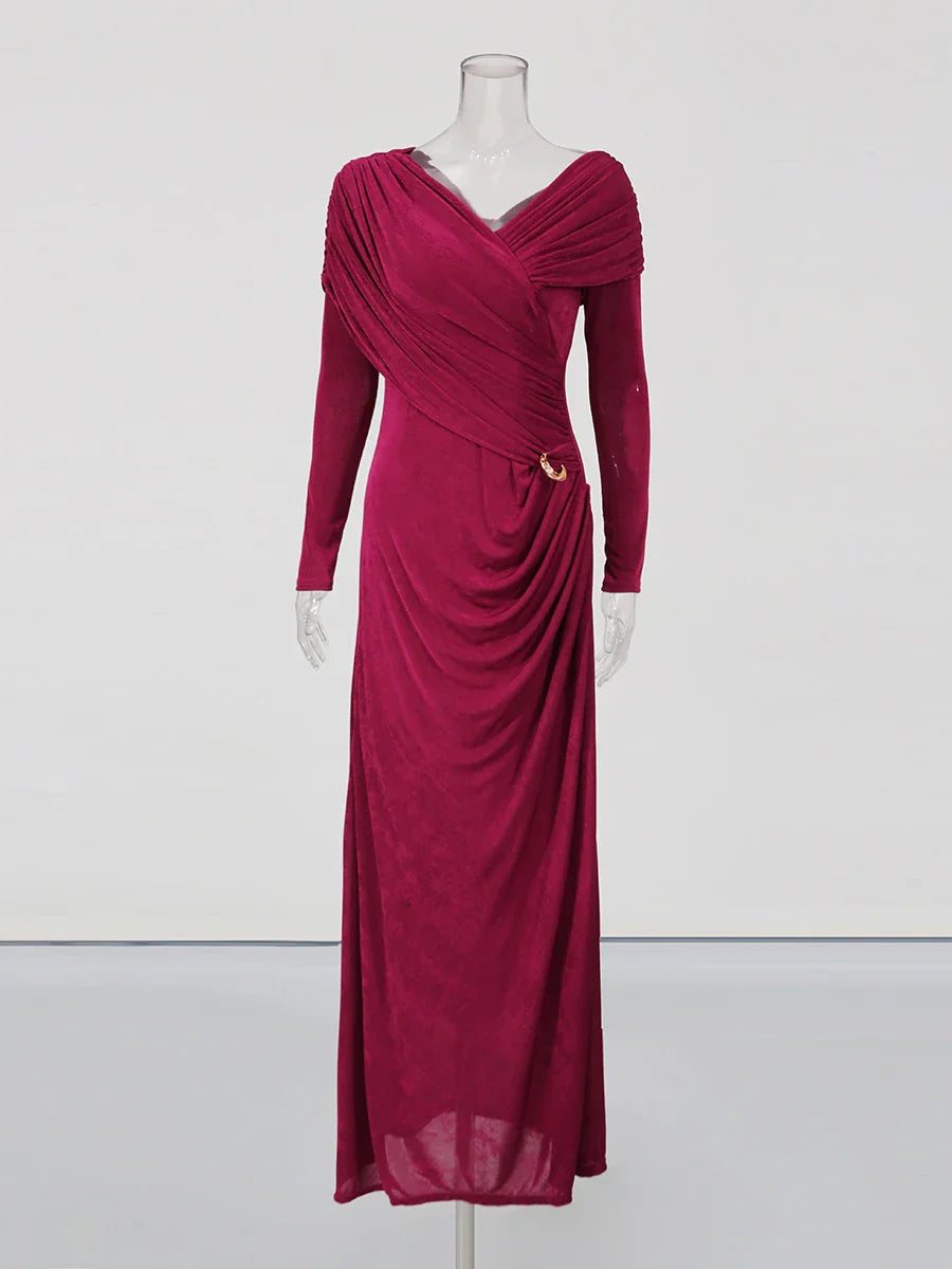 Magenta evening gown on a mannequin against a white background