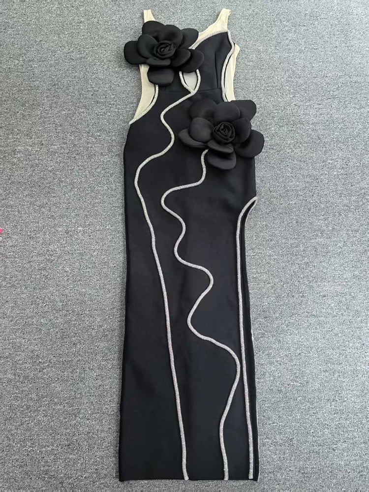 Black dress with floral straps on a gray background