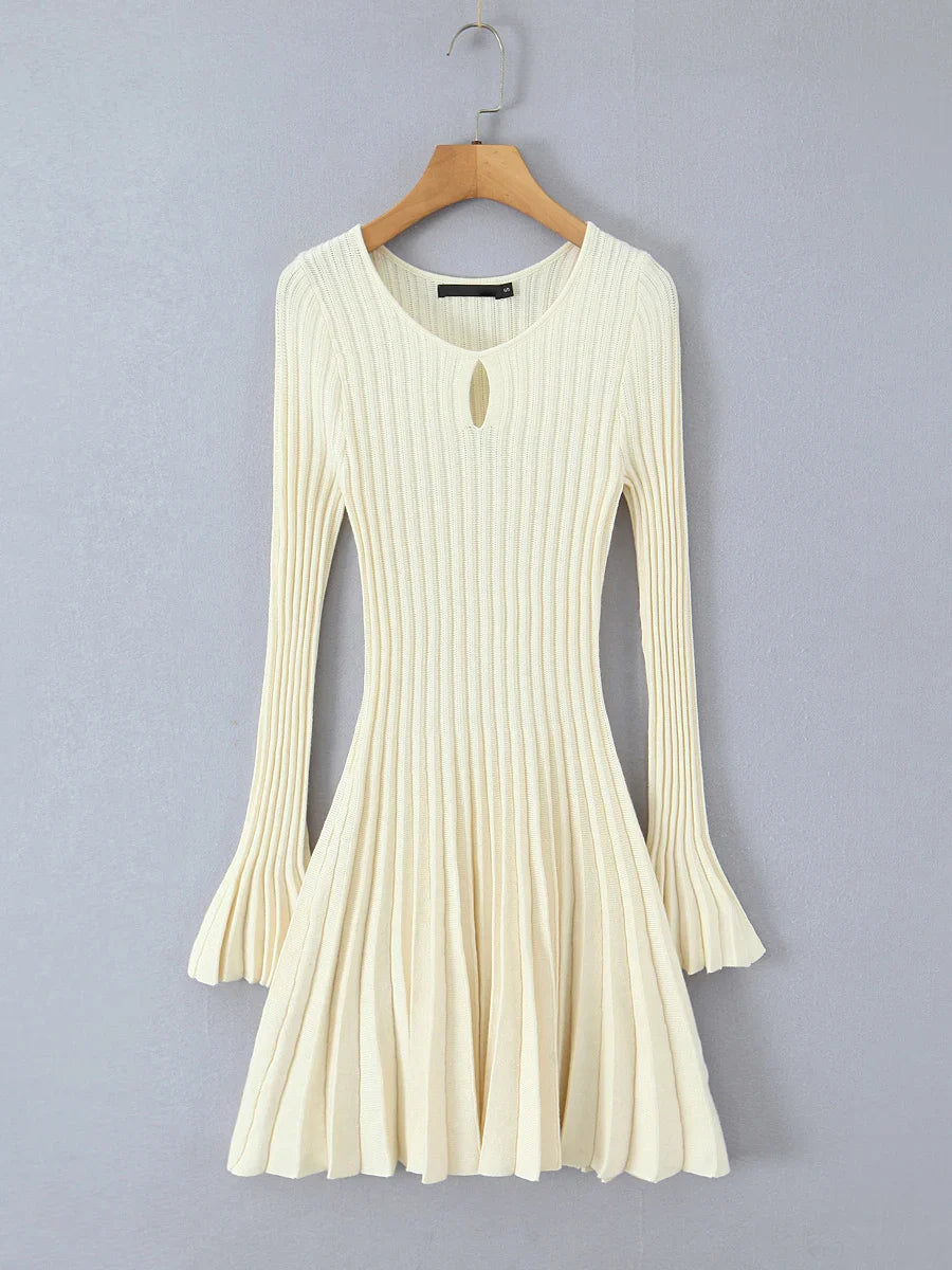 White ribbed dress on a wooden hanger - full flare sleeves